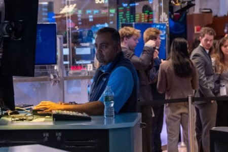 Wall Street today: US stocks trade in green as Fed cuts benchmark rates, dollar drops