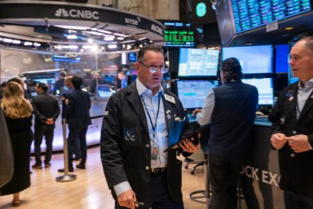 Dow drops 300 points, Nvidia, Apple close at fresh records