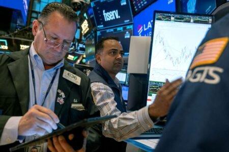 S&P 500, Nasdaq Rise as Tesla Surges 22%; Dow Closes Lower for 4th Straight Day