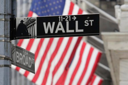 Asian shares are mixed and the yen slips against the dollar